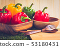 sweet peppers on wooden table background 53180431