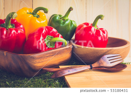 sweet peppers on wooden table background 53180431