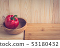 sweet peppers on wooden table background 53180432