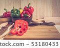 sweet peppers on wooden table background 53180433