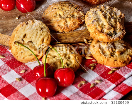 Oatmeal cookies snack and cherry breakfast close up 53180499