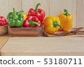 sweet peppers on wooden table background 53180711