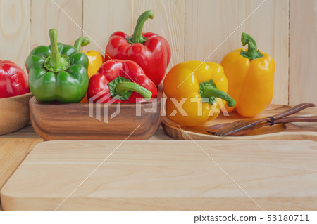 sweet peppers on wooden table background 53180711