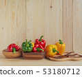 sweet peppers on wooden table background 53180712