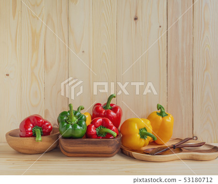 sweet peppers on wooden table background sweet peppers on wooden table background 53180712