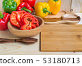 sweet peppers on wooden table background 53180713
