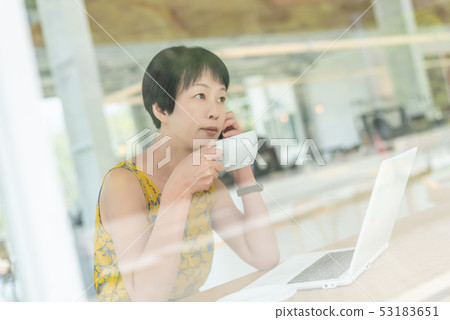 Asian woman working and using laptop Asian woman working and using laptop 53183651
