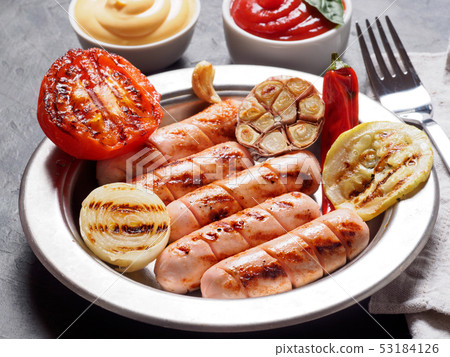 Grilled chicken sausages close up 53184126