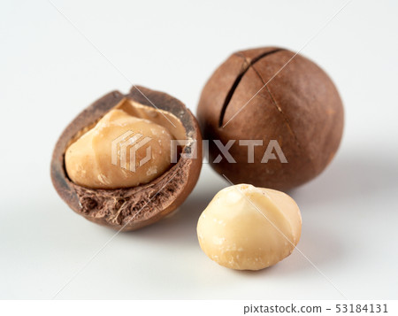 Three macadamia nuts isolated on white 53184131