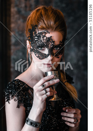 Attractive woman in black dress in medieval interior Attractive woman in black dress in medieval interior 53185196