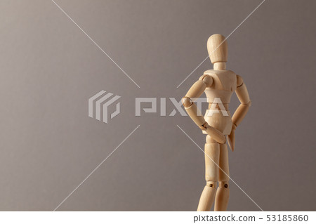 The man turned his back, displeased, on a gray background. Copy space for text. The man turned his back, displeased, on a gray background. Copy space for text. 53185860