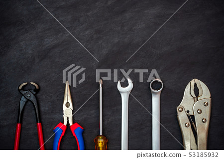 Craftsman tool on black cement background. 53185932