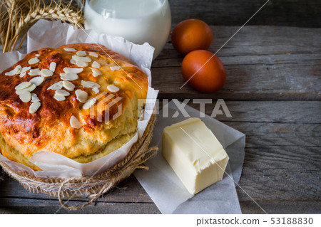 Easter bread and ingredients on rustic wood background 53188830