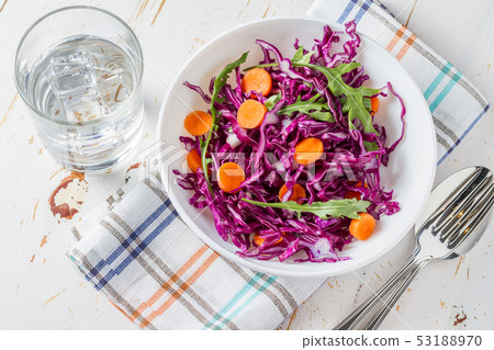 Red cabbage salad with carrot and arugula 53188970