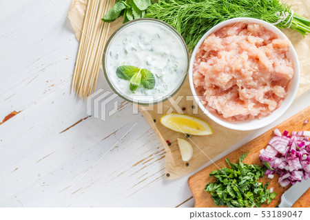Souvlaki and ingredients, white wood background 53189047