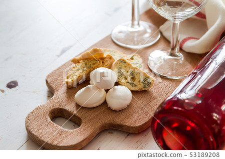 Traditional italian cookies served with wine 53189208
