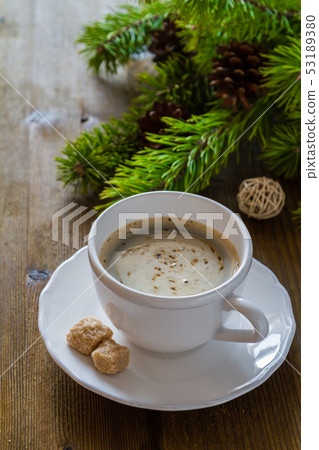 Coffee in white cup with christmas tree Coffee in white cup with christmas tree 53189380