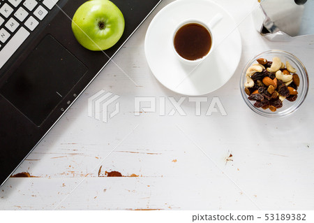 Notepad pen phone and breakfast, white wood background Notepad pen phone and breakfast, white wood background 53189382
