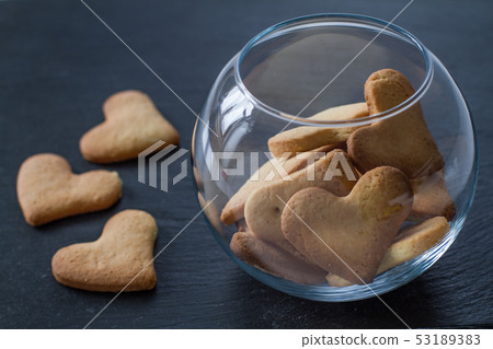 Heart shaped cookies in glass bowl Heart shaped cookies in glass bowl 53189383