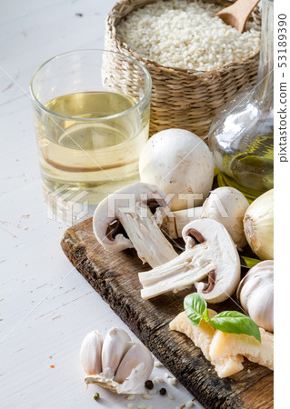 Risotto ingredients on wood board Risotto ingredients on wood board 53189390