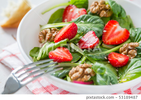 Strawberry salad in white bowl 53189487