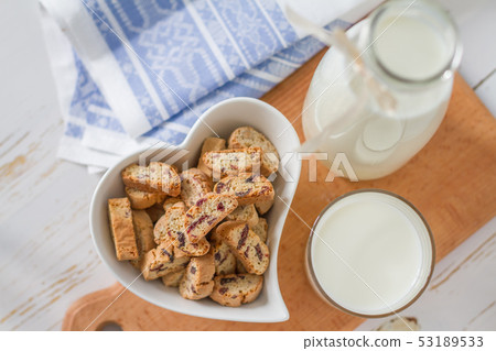 Milk and cookies on white background 53189533