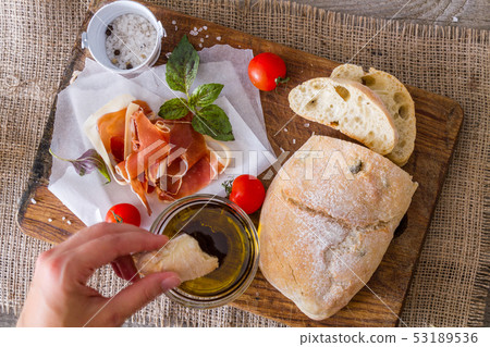 appetizer - ciabatta, ham, basil, tomato 53189536