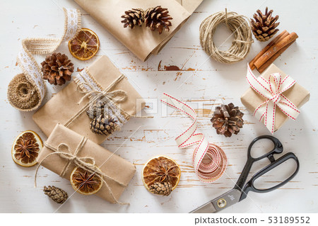 Christmas presents in rustic wrap Christmas presents in rustic wrap 53189552