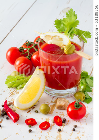 Bloody Mary ingredients on white wood background Bloody Mary ingredients on white wood background 53189556