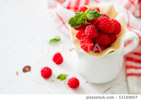 Raspberries in waffle cone 53189607