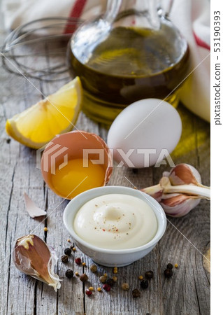 Mayonaise ingredients on rustic wood backgound Mayonaise ingredients on rustic wood backgound 53190393