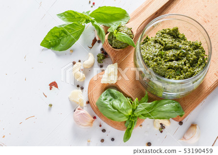 Pesto sause and ingredients on white background Pesto sause and ingredients on white background 53190459