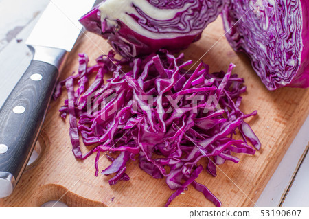 Sliced red cabbage on wood board Sliced red cabbage on wood board 53190607