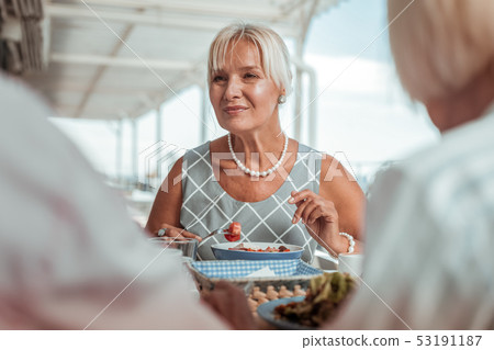 Amazing blonde woman eating her healthy food 53191187