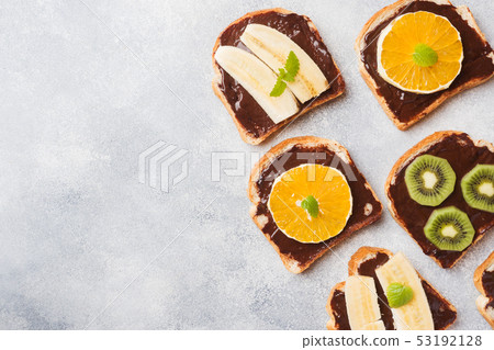 Sandwiches with chocolate paste and various fruits Sandwiches with chocolate paste and various fruits 53192128