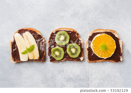 Sandwiches with chocolate paste and various fruits Sandwiches with chocolate paste and various fruits 53192129