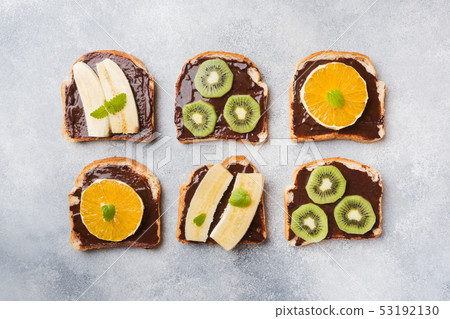 Sandwiches with chocolate paste and various fruits Sandwiches with chocolate paste and various fruits 53192130