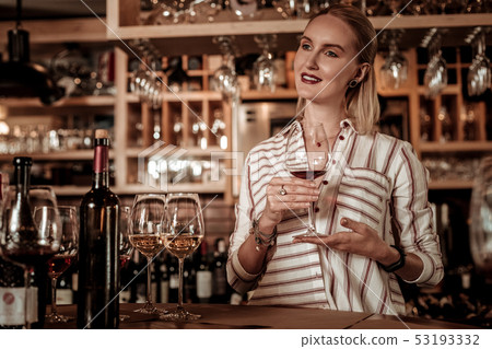 Positive delighted woman being deep in thoughts 53193332