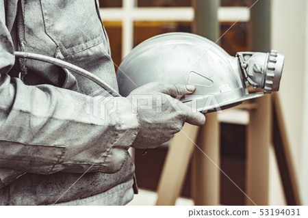 sculpture of a miner holding a helmet sculpture of a miner holding a helmet 53194031