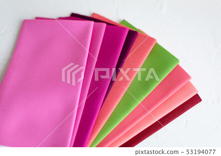 A Group of Twisted Colored Fabric on white 53194077