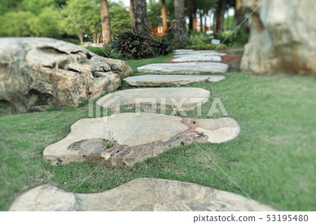 Stone path in green grass Stone path in green grass 53195480