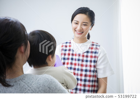 Nursery teacher and mother and child Nursery teacher and mother and child 53199722