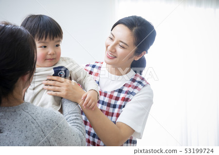 Nursery teacher and mother and child 53199724