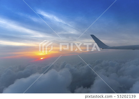 Wing of the air plane on the sea of cloud sunset Wing of the air plane on the sea of cloud sunset 53202139