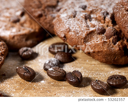 Oatmeal chocolate cookies with coffee grains and cherry. Sun flare Oatmeal chocolate cookies with coffee grains and cherry. Sun flare 53202357