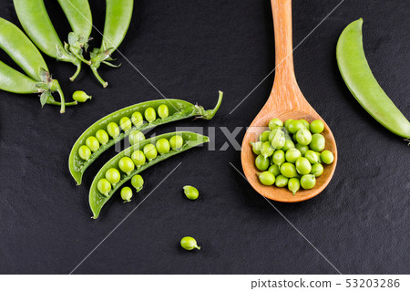Sugar snap peas with mint on a rustic wood Sugar snap peas with mint on a rustic wood 53203286