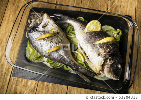 two Dorada fish cooked in the oven with lemon, two Dorada fish cooked in the oven with lemon, 53204318