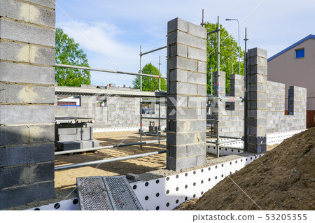 Concrete foundation of a new house, view of construction site in preparation process Concrete foundation of a new house, view of construction site in preparation process 53205355