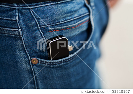 Man holding mini adapter for laptops and flash memory 53210167