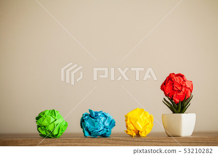 Creative idea concept. Crumpled paper balls on wood background 53210282